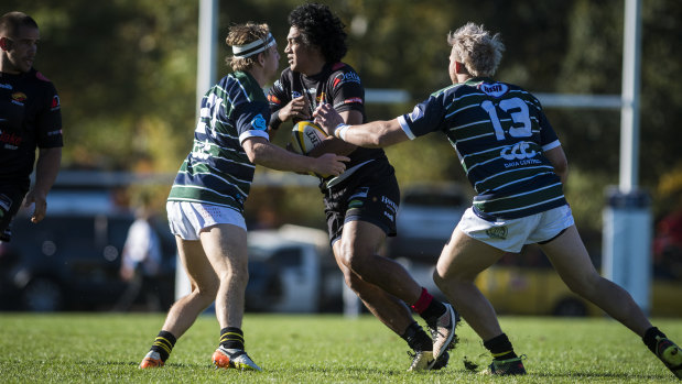 Gungahlin's Eli Sinoti being tackled. Photo: Dion Georgopoulos