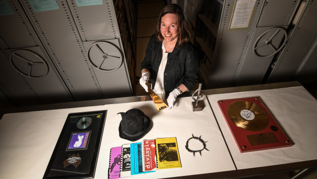 Australian Music Vault senior curator Carolyn Laffan with some of the items from Chrissy Amphlett's career.