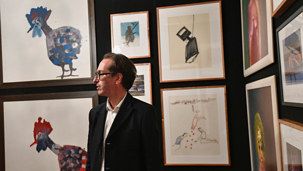 Art consultant Mark Fraser with some of Sidney Nolan's paintings from the estate of his widow Mary Nolan, which will go to auction on June 26.