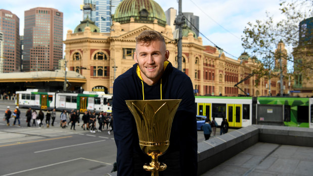 Eyes on the prize: Australian Boomer Jock Landale with the FIBA World Cup trophy in Melbourne on Wednesday.