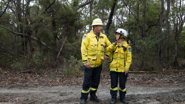 Michael and Sally Elvidge from Hornsby Ku-ring-gai RFS strike team are spending Christmas Day clearing a trail in the bushland to help contain nearby fires.