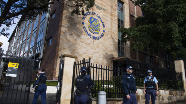 Police outside Waverley College on Tuesday after a student was diagnosed with COVID-19.