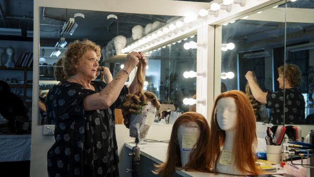 Wig technician Lynn Coubrough in the Opera Australia wig storage room. 