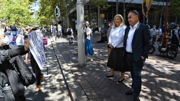 NSW Deputy Premier John Barilaro and Minister for Women Bronnie Taylor observe the protest in Sydney. 