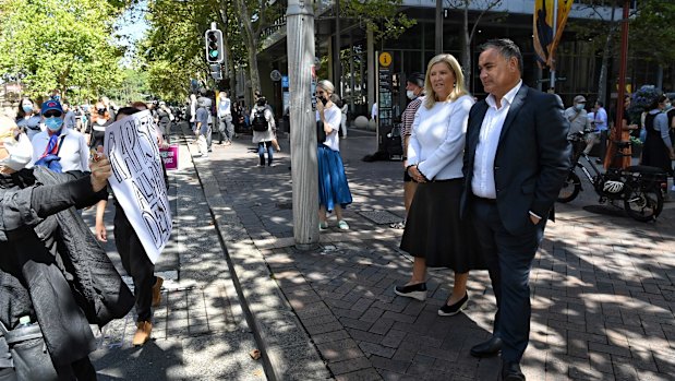 NSW Deputy Premier John Barilaro and Minister for Women Bronnie Taylor observe the protest in Sydney. 