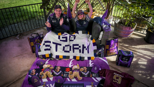 Melbourne Storm fan Bronwyn Smith with her son-in-law Warren Hall prepare to watch the team from home on Saturday night.