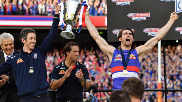 Easton Wood (right) has retired after 188 games, most famously captaining the Bulldogs to the 2016 flag.