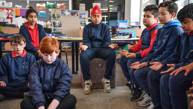 Year 5 and 6 students at Dandenong Primary School prepare for maths.