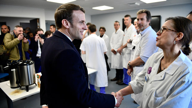 French President Macron on a visit to the Pitie-Salpetriere hospital in February.