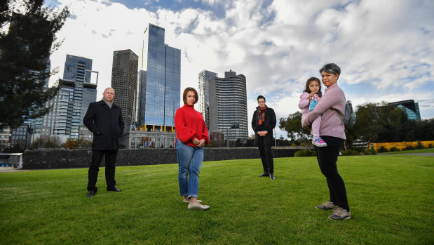 Convener of the East Melbourne Group's planning committee Greg Bisinella, resident Valerie Stroehle, Cr Rohan Leppert and resident Elinor Colaso, with Olivia, four, at Birrarung Marr. 