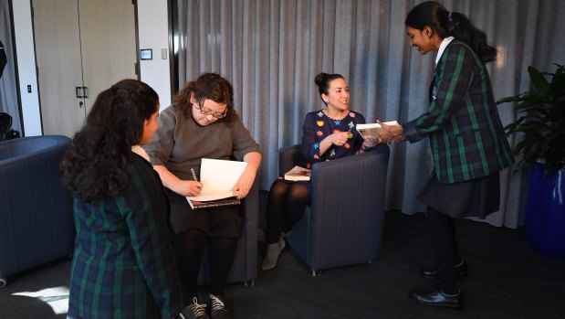 Students Isha Desai, left, and Ashwini Sitha-Nanthan, right, from North Sydney Girls High School, meet authors Fiona McFarlane, centre left, and Sarah Krasnostein at the Kibble and Dobbie Literary Awards. 
