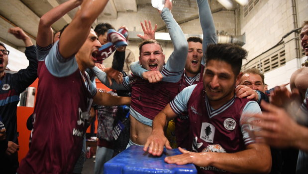 What an upset: APIA Leichhardt celebrate their FFA Cup win over Melbourne Victory.