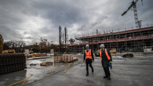 ANU vice-chancellor Brian Schmidt and ACT Chief Minister Andrew Barr tour the construction site of the Union Court redevelopment earlier this month.
