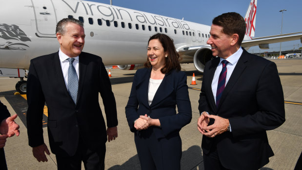 Virgin Australia group executive Rob Sharp, Queensland Premier Annastacia Palaszczuk and State Development Minister Cameron Dick at Brisbane Airport.