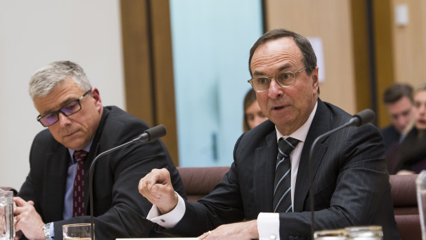 7-Eleven chief executive officer Angus McKay and chairman Michael Smith give evidence at the senate inquiry into franchising. 