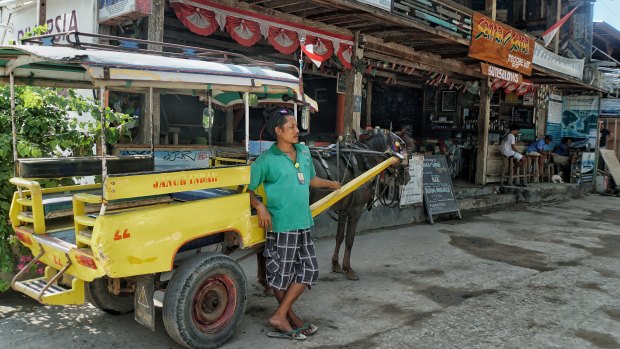 Wildan waits for tourists on Gili Trawangan with his horse and cart.