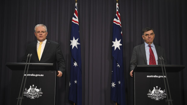 Prime Minister Scott Morrison and Chief Medical Officer Brendan Murphy speak to the media on Tuesday night.