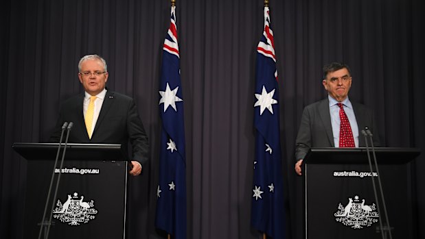 Prime Minister Scott Morrison and Chief Medical Officer Brendan Murphy speak to the media on Tuesday night.