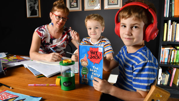 Zoe Collins is seen doing school work with her children Dare (5) and Douglas (7) at their home in Brisbane.