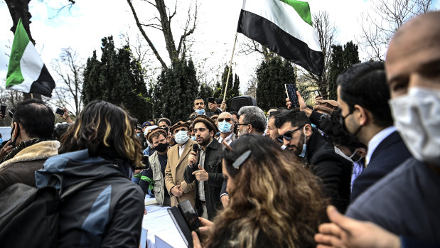 Ahmad Massoud (centre), the son of late Afghan commander Ahmad Shah Massoud, speaks to supporters in May at the naming of an alley along the Champs-Elysees in Paris named after his father.