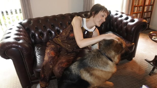 Gungahlin woman Tanya Gendle at home with her dog Atlas.