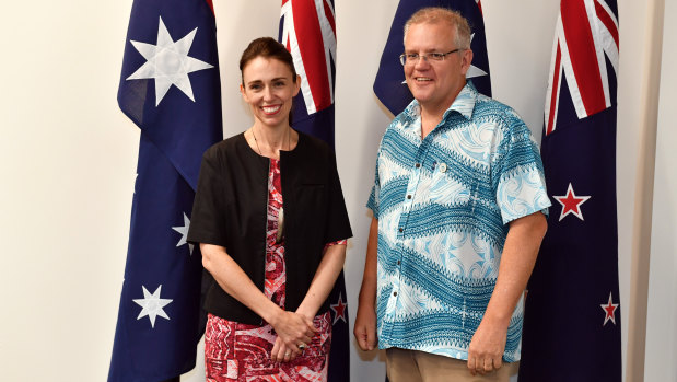 No socks required ... New Zealand Prime Minister Jacinda Ardern meets Scott Morrison at the Pacific Islands Forum on Tuvalu.
