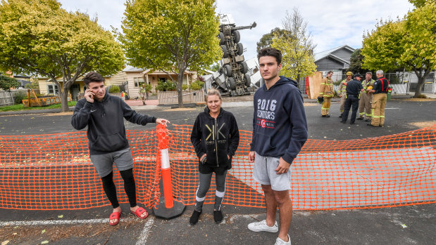 Anna Pace (centre) with son Fred (left) and cousin Daniel Pantalleresco were all in the house when the crane collapsed onto their home.