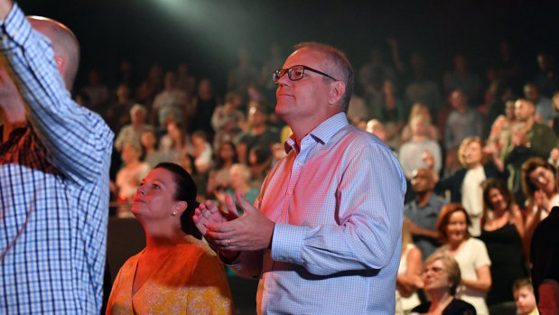 Prime Minister Scott Morrison and wife Jenny sing during an Easter Sunday service at his Horizon Church in Sydney during the 2019 election campaign.