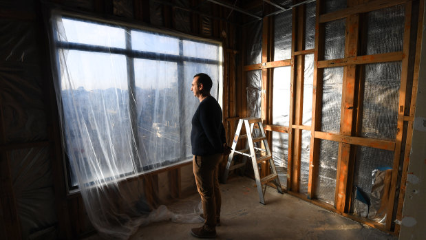 Trent in his St Kilda apartment, which has been gutted due to water damage. 