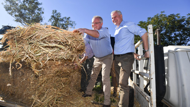 Scott Morrison and Deputy PM Michael McCormack on a drought-affected farm near Dubbo on Saturday.