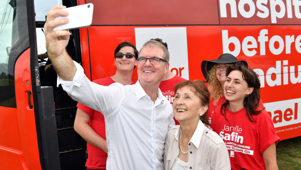 Labor leader Michael Daley takes a selfie with Labor candidate for Lismore, Janelle Saffin, and campaign workers on Thursday.
