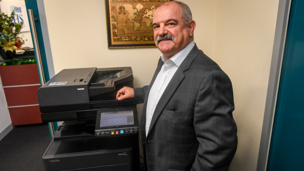 Rocky Tempone's business still fires up the fax machine on his multi-function device each week. 