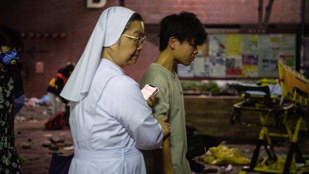 An anti-government protester under the age of 18 is allowed to leave Hong Kong Polytechnic University.