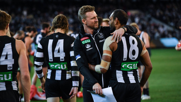 Eyes on the Pies: Nathan Buckley congratulates Travis Varcoe after Collingwood set up a preliminary final against Richmond.