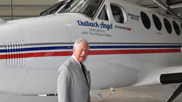 Prince Charles unveils the newest addition to the fleet during a visit to the Royal Flying Doctor Service base in Cairns on Sunday.