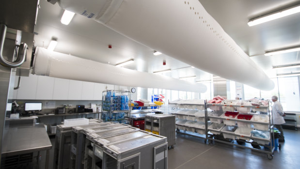 Inside the cold kitchen where meals are finished and loaded into airplane trays. 