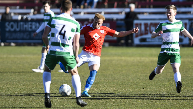 Canberra FC's Thomas James looks to shoto.