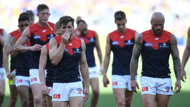 The Demons leave the field after last year's preliminary final loss to West Coast.