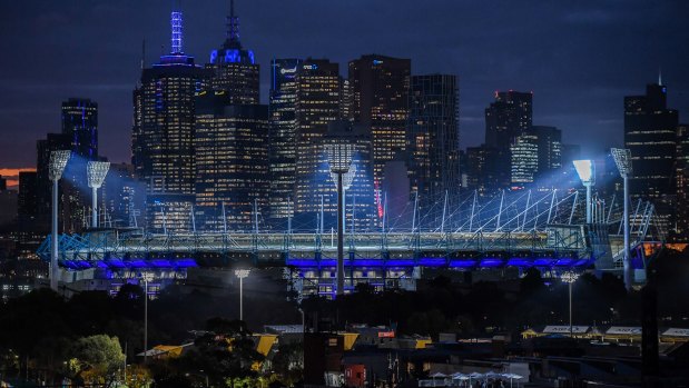 Some buildings in Melbourne turned blue in a tribute to the four police officers who died on the Eastern Freeway a year ago. 