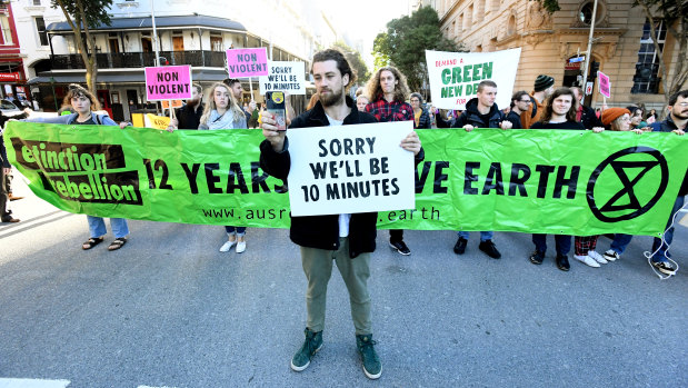 Extinction Rebellion protesters held placards and banners in front of many infuriated drivers.