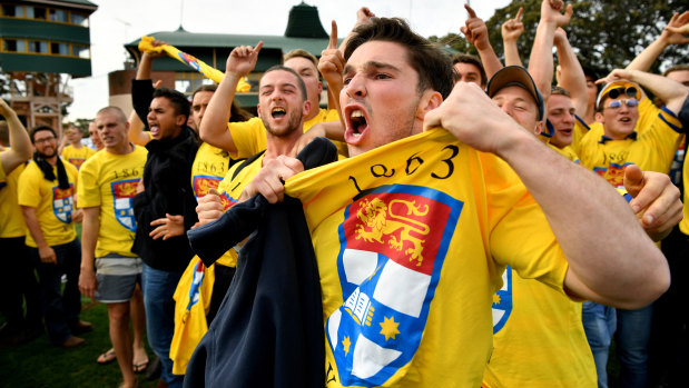 Canary yellow fever: Sydney University supporters taunt their Warringah counterparts .