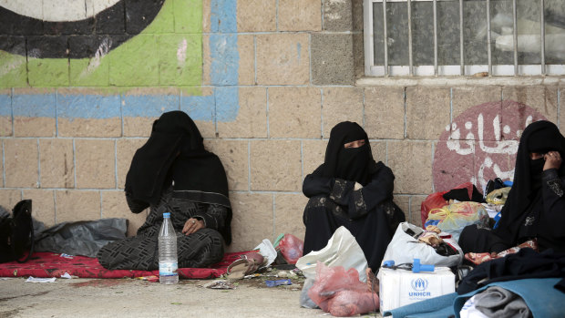 Displaced Yemeni women, who fled their homes because of fighting the port city of Hodeida, sit in a school in Sanaa last weekend.