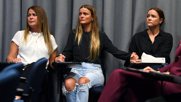 Jennifer Schefe and Henry’s daughters Grace and Megan look on as police announce a fresh appeal into the unsolved murder.