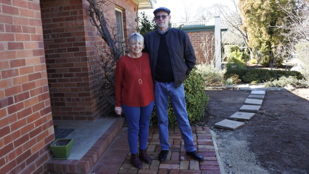 June and Jeff Dreese outside their Narrabundah home. The pillars were found in the area which is now newly bricked.