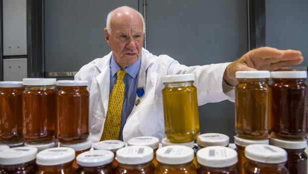 Bruce White in his long-standing judging role in the honey competition at the Royal Easter Show. 