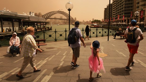 A strong wind change has swept dust over Sydney on Thursday.