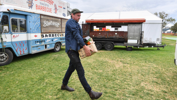 Chris Terlikar from Bluebonnet food truck packs up after the cancellation of the grand prix.