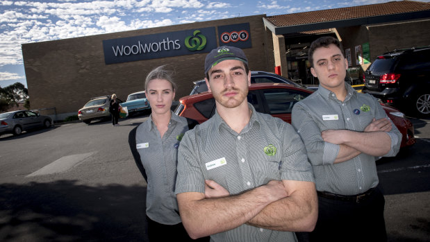 Woolworths employees Sarah Cleary, Andrew Berecz and Loukas Kakogiannis outside the chain's Moorabbin store.