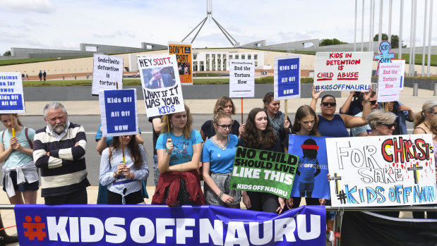 Protesters outside Parliament House call for the resettlement of children held on Nauru. 