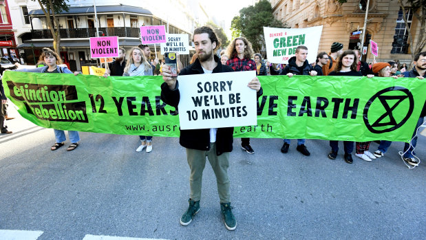 Extinction Rebellion protesters have held placards and banners in front of many infuriated drivers.
